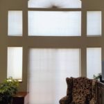 Elongated Arch cellular shade window treatment.